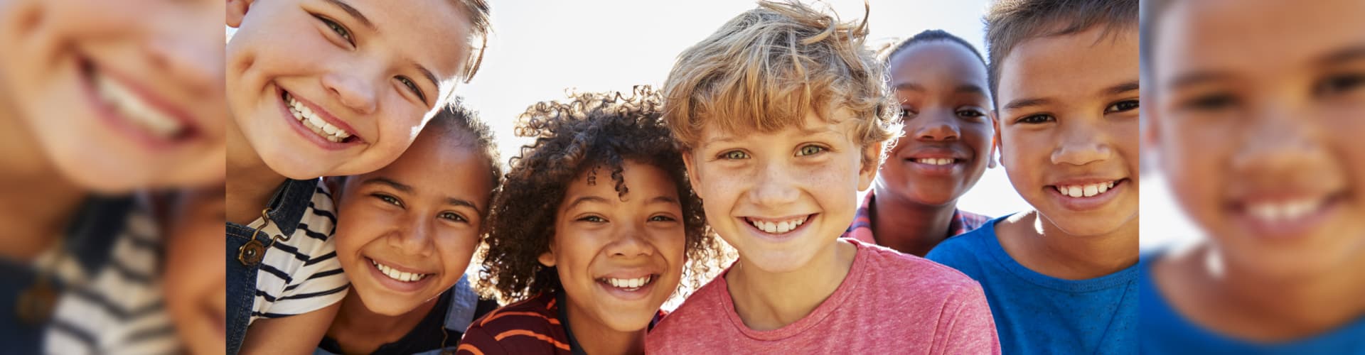 children smiling on camera